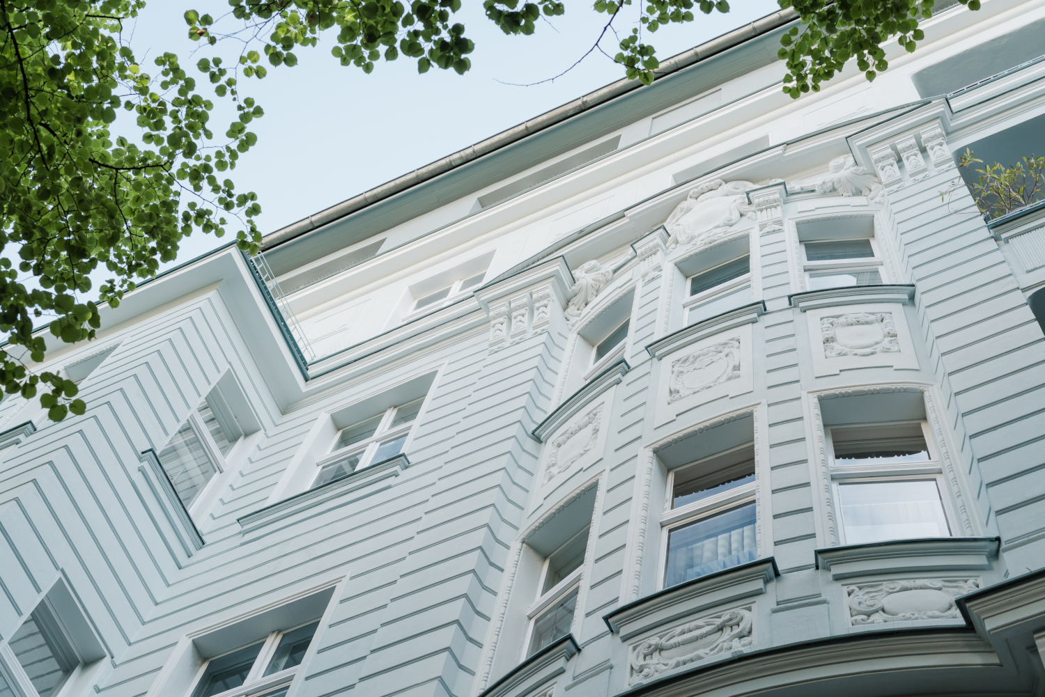 Renovated old building with a simple but charming façade and traditional elements that preserve the historic flair of the house.